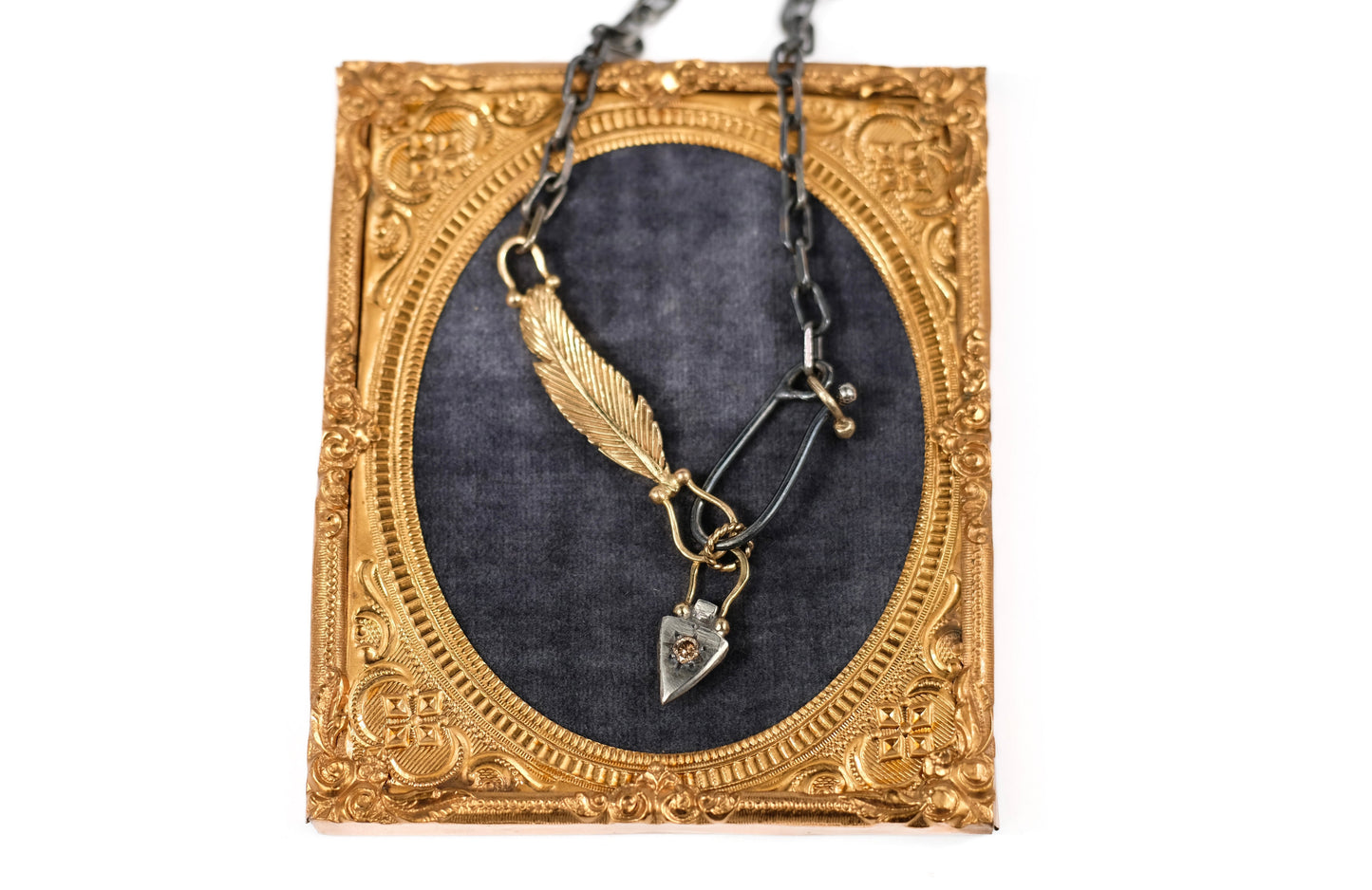 Gold feather charm holder